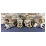 (4) CERAMIC SHELF SITTING BABY FIGURINES