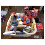 LAUNDRY BASKET FILLED WITH CLEANING SUPPLIES