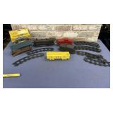 TRAIN CARS AND TRACK PIECES