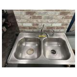 STAINLESS SINK W/ DELTA FAUCET