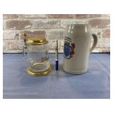 (2 PCS) GERMAN STEINS - 1 CERAMIC, 1 GLASS & BRASS