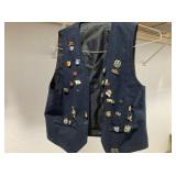 SMALL VEST WITH COLLECTION OF ENAMEL PINS