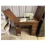 VINTAGE SINGER SEWING MACHINE IN A CABINET; MDL