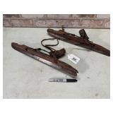 PAIR OF ANTIQUE WOODEN STRAP ON ICE SKATES WITH