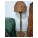 A wicker floor lamp