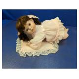 Baby Doll on Lace Pillow