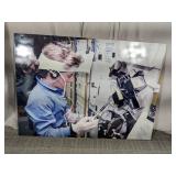 (1) Large Astronaut Working in Spacecraft Photo