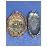 Two Ornate Oval Wall Plaques