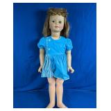 Plastic Girl Doll in Blue Dress