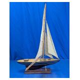 Model Sailboat on Wooden Display Stand