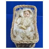 (1) Porcelain Baby Doll in Wicker Bassinet