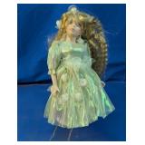 Porcelain Doll With Iridescent Dress