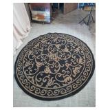 Round Black & Tan Scrollwork Area Rug