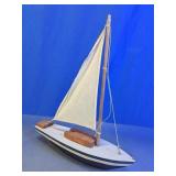 Wooden Sailboat Model with White Sail