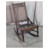 Carved Wooden Cane Back Rocking Chair