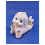 Reclining Baby Figurine