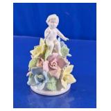 Child Figurine with Pastel Floral Arrangement