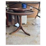 Round Wooden Table with Lower Shelf and Decorative Wooden Bowl