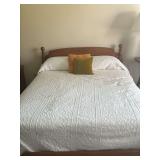 Wood Frame Full Size Bed with White Quilt and Pillows