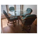 Rattan Dining Set with Glass Top Table and Four Rolling Chairs