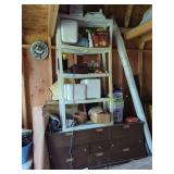 Shelving unit with assorted household items.