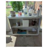 White Shelf Unit with Various Items