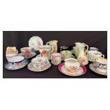 Assorted Decorative Tea Cups, Saucers, and Creamers