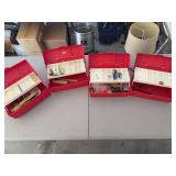 Four Red Toolboxes with Various Contents
