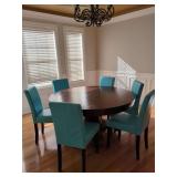Round Table with Six Teal Chairs