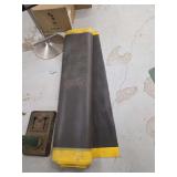 Two Rolls of Black Rubber Material with Yellow Edges