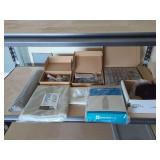 Household Items: Delta Shower Head, Ironing Board Cover, Drawer Pulls, Over The Door Organizer, Shelf Liner, and Sheets