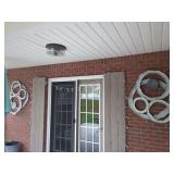 Two matching metal wall hangings and string lighting
