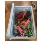 BLUE RUBBER MAID CONTAINER WITH HAIR CURLERS