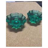 TWO GREEN GLASS CANDLE HOLDERS
