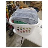 CLOTHES BASKET OF TOWELS