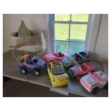 Assorted Toy Vehicles Including Barbie Cars and Stroller