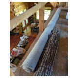Roll of Carpet and Area Rug