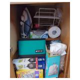 Household Items Including Cooler, Trash Bags, and Napkins