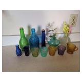 Collection of Assorted Colored Glass Bottles and Vases