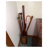 Collection of Walking Sticks and Umbrella in Bamboo Stand