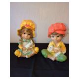 Pair of Children Holding Pets Figurines