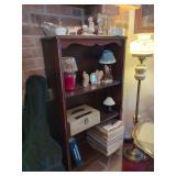 Shelf with Assorted Collectibles and Magazines