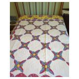Handmade Quilt with Floral and Geometric Patterns