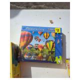 Four Boxed 1000-Piece Jigsaw Puzzles