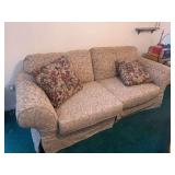 Upholstered Three-Seat Sofa with Floral Pillows