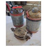 Two Metal Gas Cans and Wooden Pulley
