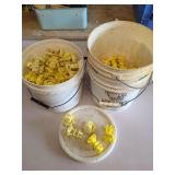Two Buckets of Yellow Irrigation Emitters