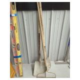 Assorted Garden Tools Including Shovels and Rake