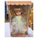 NIB GENUINE FINE BISQUE PORCELAIN DOLL