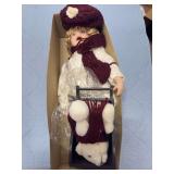 PORCELAIN DOLL WITH SLEIGH AND BEAR